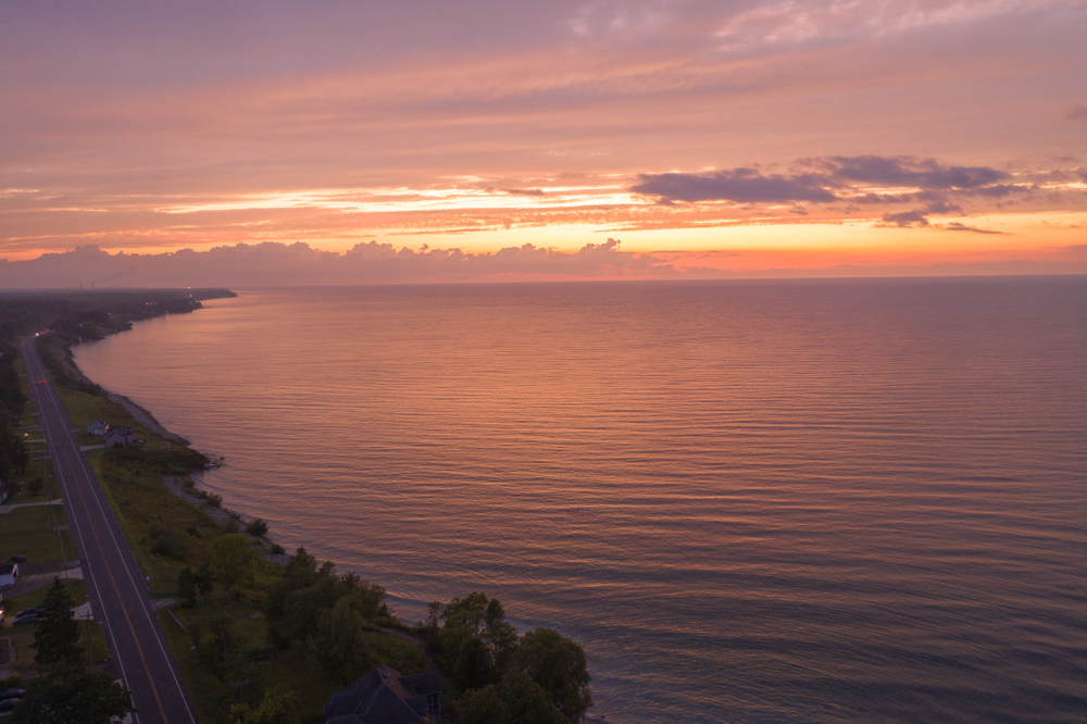 Spectacular Lake Erie sunset in sky at  Lakeshore beach in Ohio.