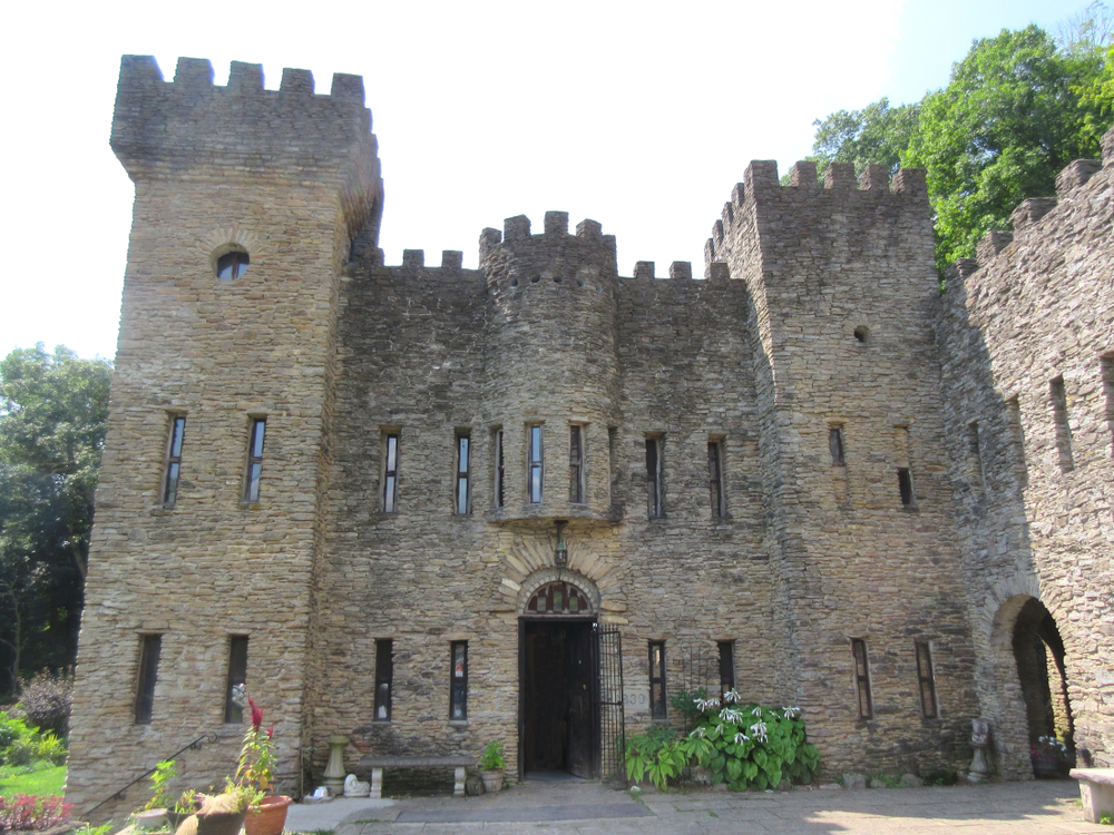 Stone castle in Ohio with decorative stone top and round turret. 