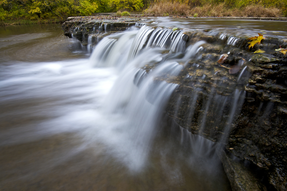 Kankakee River waterfall rushing over rocks. Great Chicago day trip.