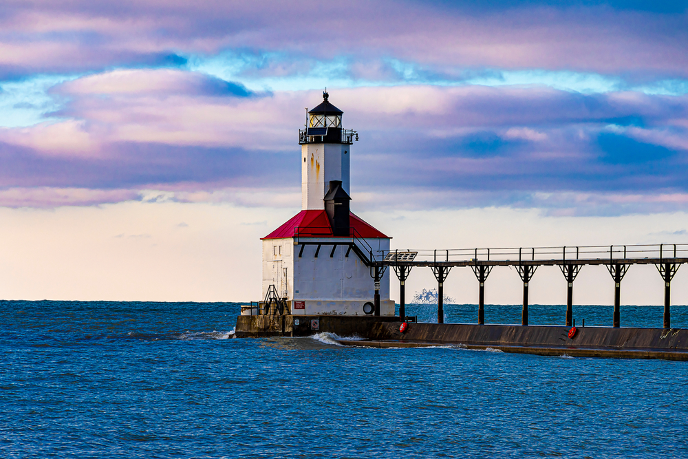 Michigan City lighthouse white with red roof on Lake Michigan, a Chicago day trip.