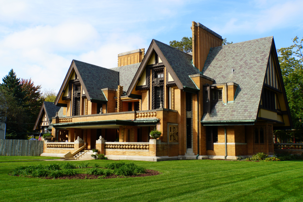 An architectural marvel, a Frank Lloyd Wright home in Oak Park with manicured front lawn.