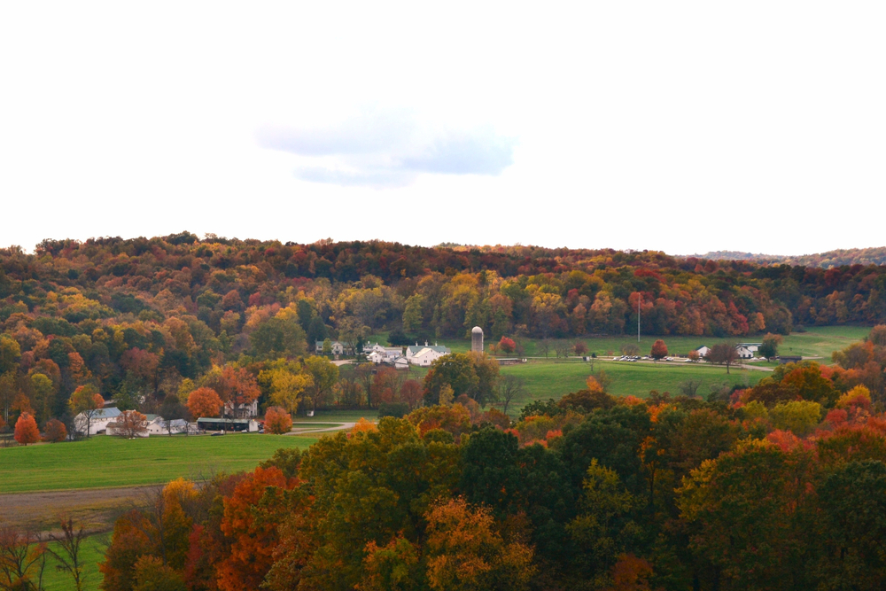 Photo of Malabar farm one of the haunted places in Ohio, nestled between trees with bright autunm colors.