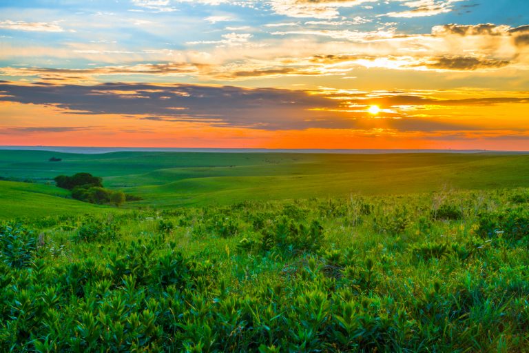 Gorgeous sunset over green hills of Flint Hills Kansas