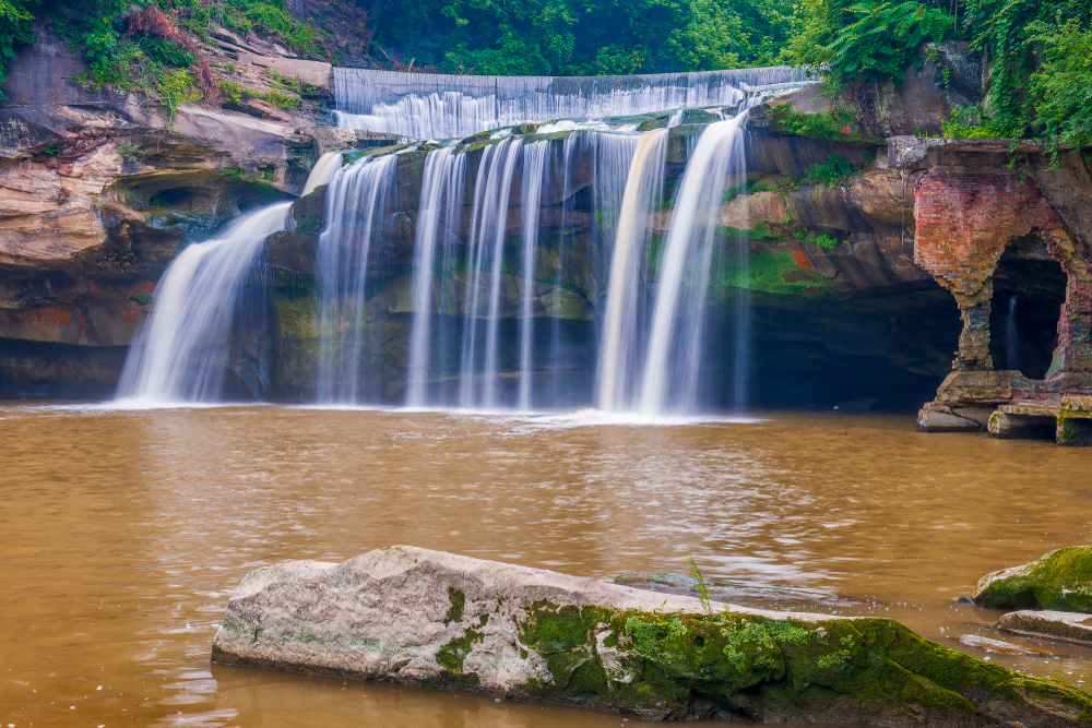 Ohio waterfalls are found everywhere. East Falls are urban waterfalls cascading over rocks into water below.