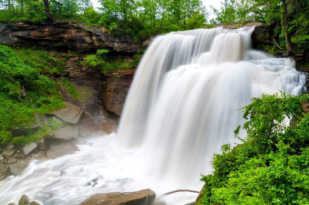 Cascading waterfalls in Ohio flowing over rock formations into pool of water below.