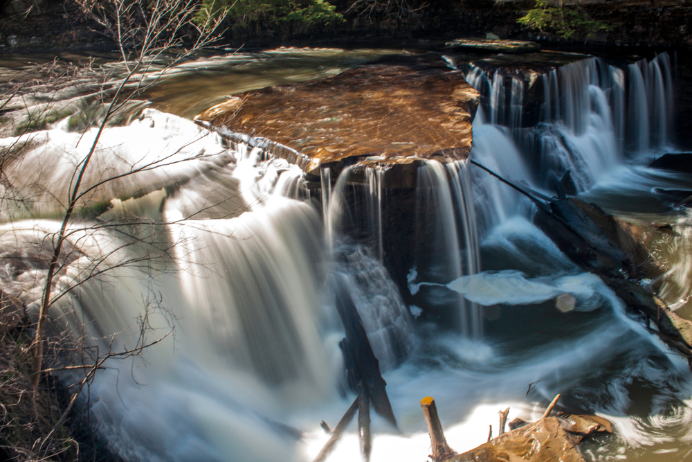 Great Falls of Tinkers Creek in in Bedford Ohio with cascading water over rock formations.