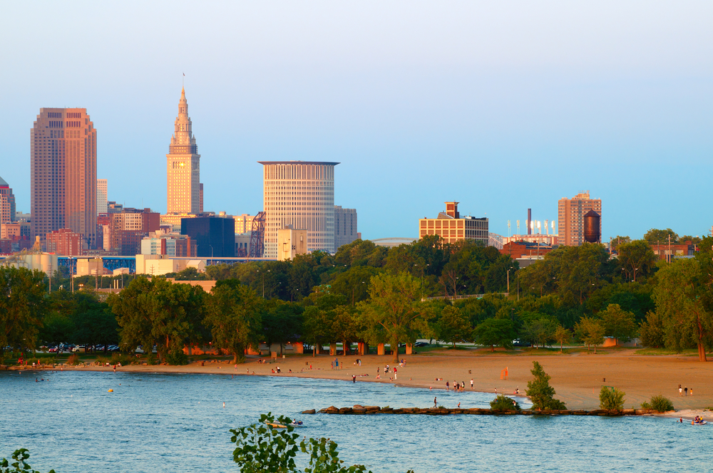 Sandy beach with Cleveland skyline behind it is one of the best Ohio beaches to visit.