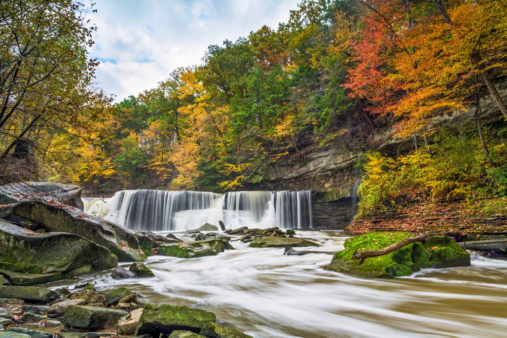 Ohio's Great Falls of Tinker's Creek is surrounded by a beautiful display of fall foliage color. Article is about the best waterfalls in Ohio. 