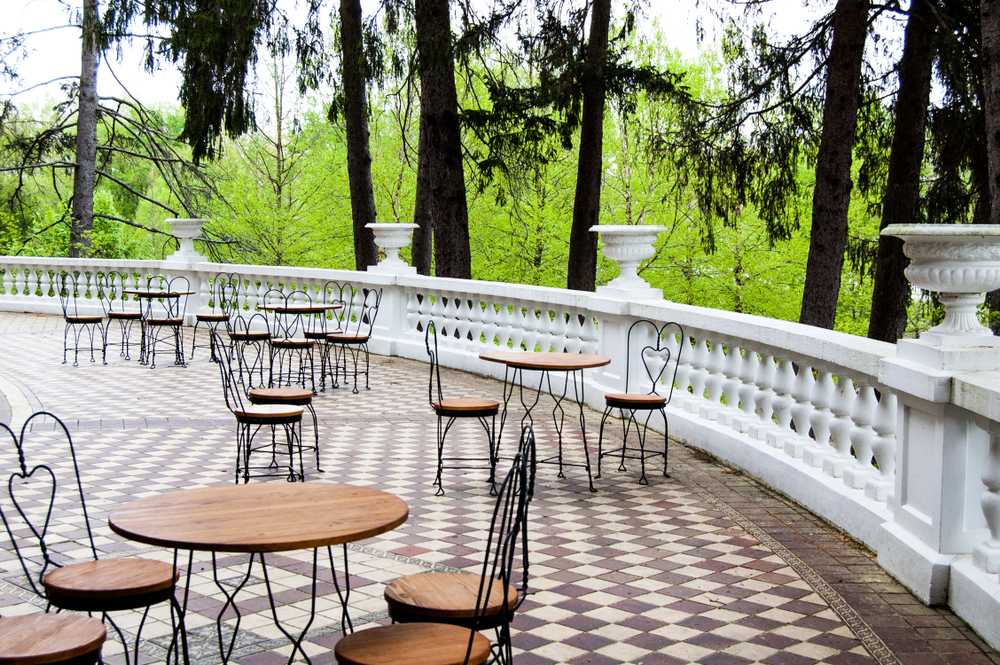 A flagstone patio surrounded by trees at the French Lick Resort in French Lick Indiana one of the most romantic midwest getaways