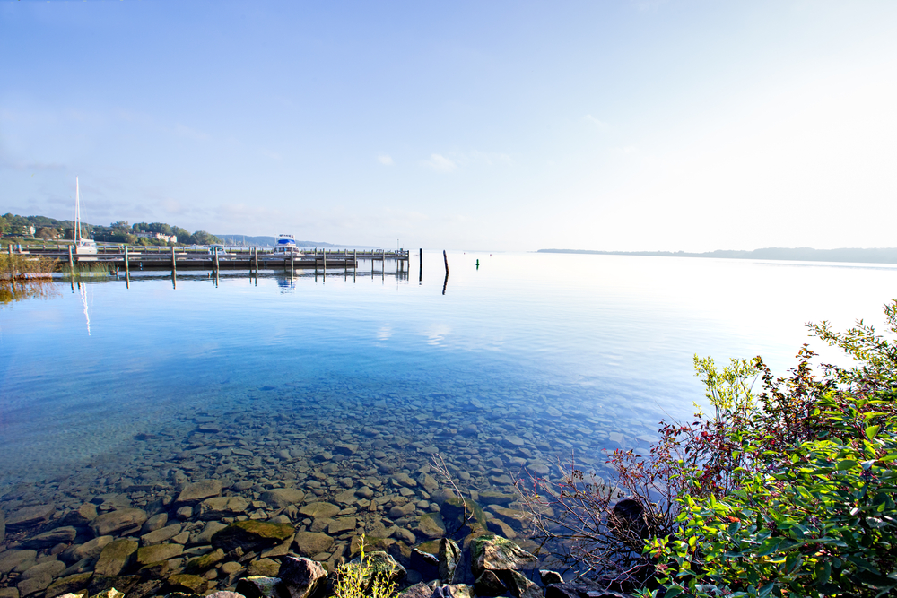 The clear blue water at Suttons Bay Michigan a romantic midwest weekend getaway.