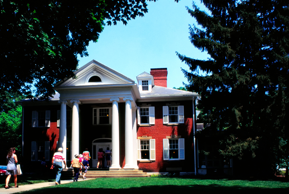 Historic red building with white columns in Athens Ohio.