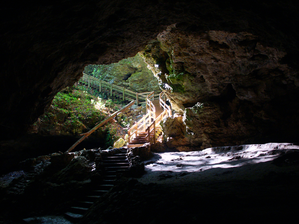 A stairway descending down a hillside into a cave. Maquoketa Caves in Iowa