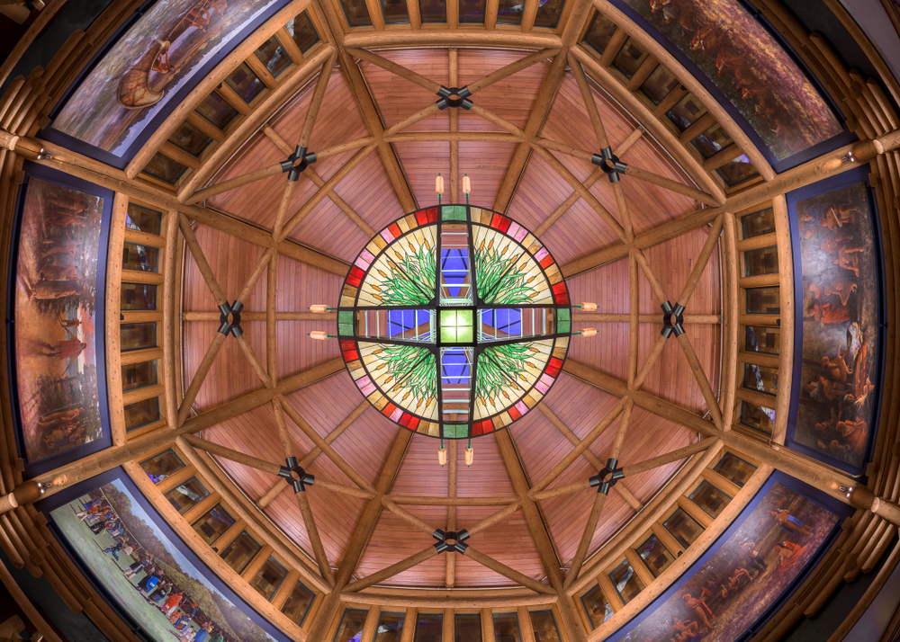 The painted domed ceiling of the Four Winds Casino Resort in New Buffalo Michigan with stained glass at the very top of the dome
