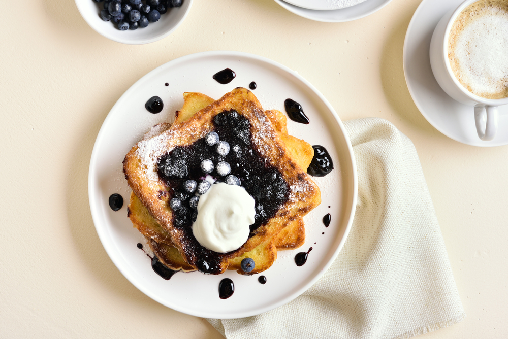 French toast with blueberries and cream on in an article about breakfast in Chicago