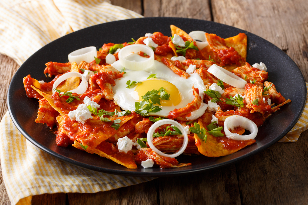 Nachos, tomato sauce and egg on a plate in an article about breakfast in Chicago