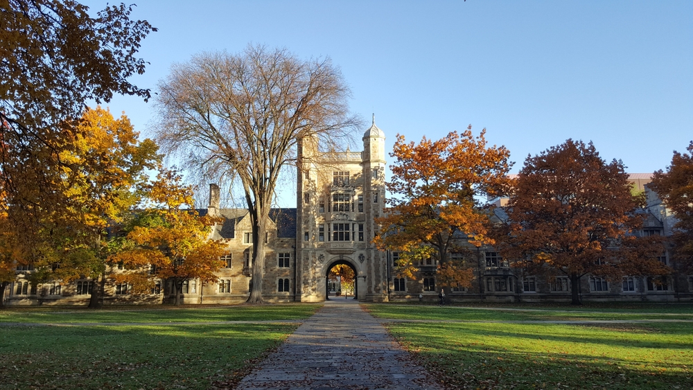 A building at the University of Michigan in Ann Arbor Michigan on a sunny fall day with the leaves changing