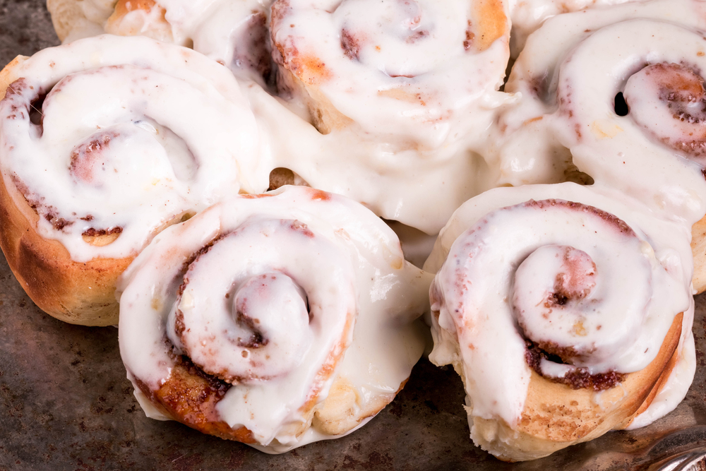 Cinnamon buns covered in icing