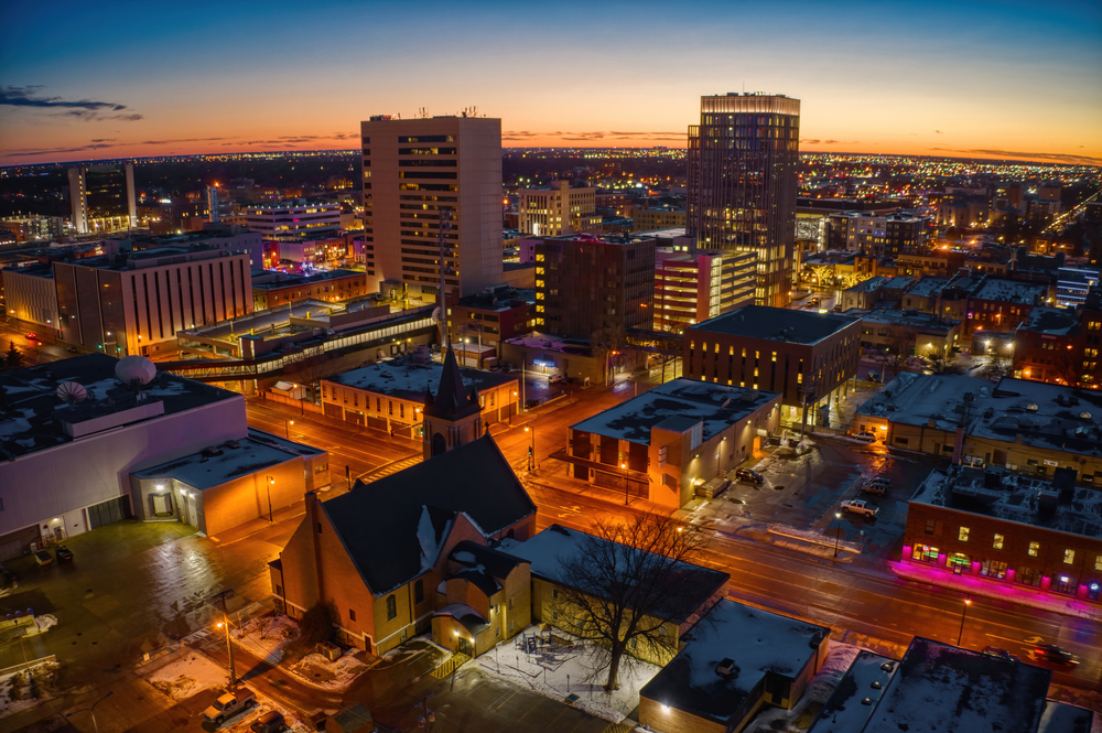 The city of Fargo at twilight with all of the buildings lit up