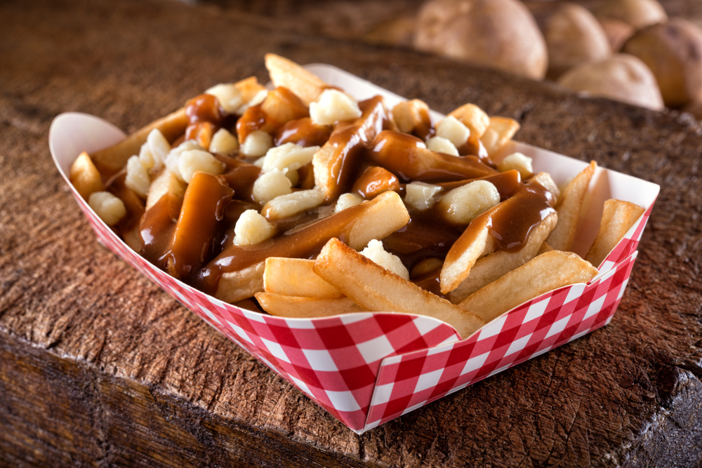 A tray of poutine fries which are french fries covered in gravy with cheese curds at one of the most unique restaurants in Cincinnati.