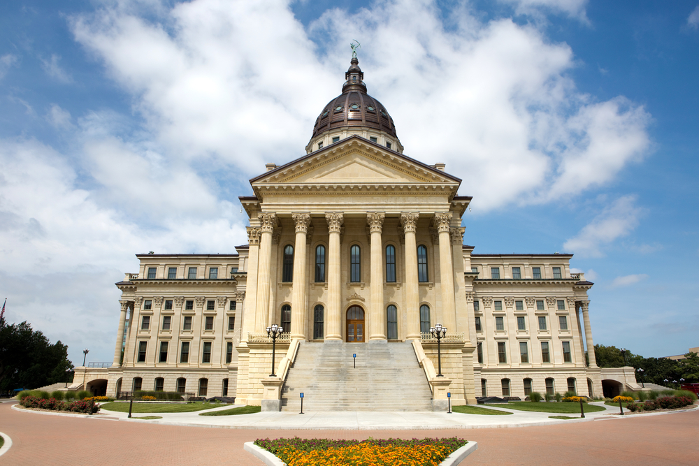 A huge white building with a dome the State Capitol Building in Kansas one of the things to do in Kansas