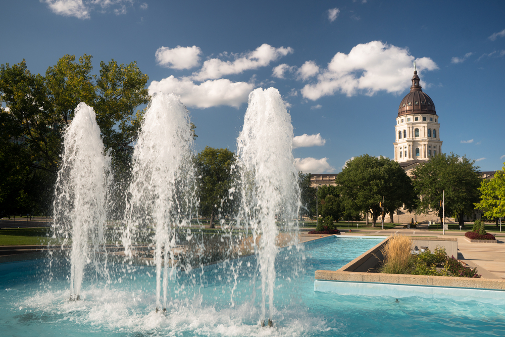 A large water feature in front of a government building in Topeka Kansas
