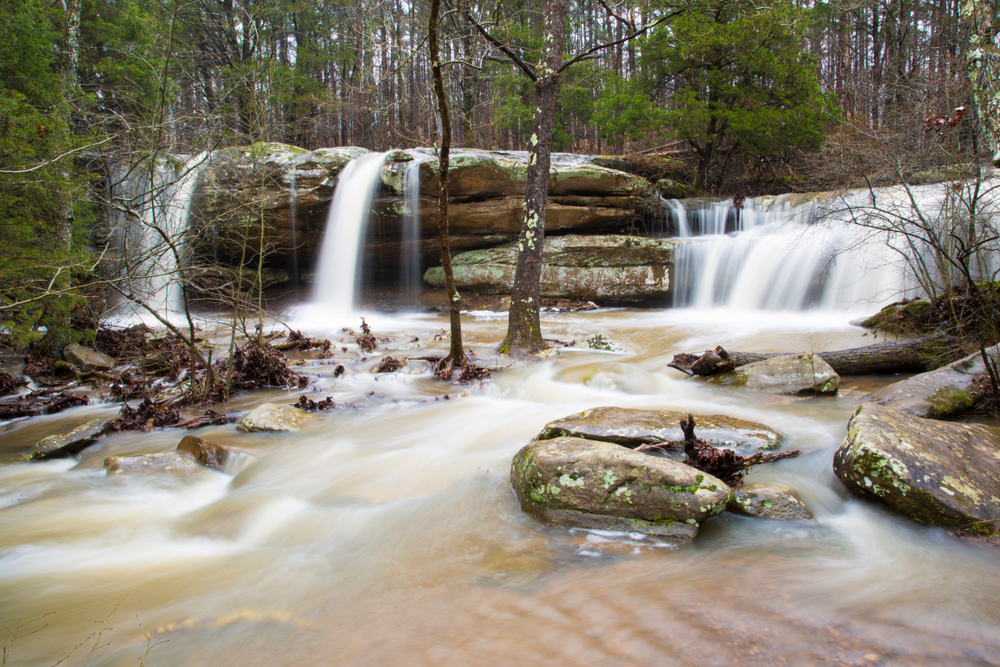 three waterfalls flowing over rocks into a rocky stream in an article about waterfalls in Illinois