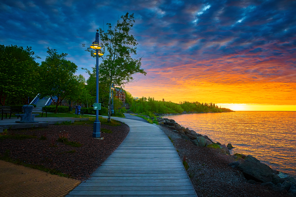 A park by a lake at sunrise Canal Park is one of the things to do in Duluth