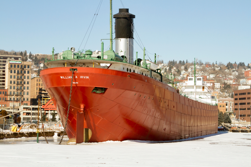 A large red ship in dock in Duluth town visiting the Merchant logo William A Irvin is one of the things to do in Duluth