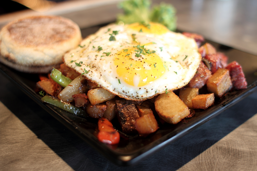 Corn Beef Hash on a plate with an english muffin. A famous Cleveland breakfast