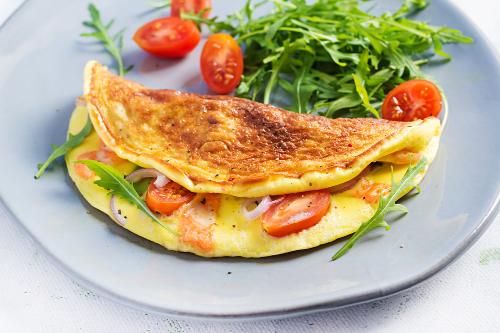 A tomato omelet with a rocket side in an article about breakfast in Cleveland