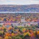 Aerial view of the skyline of Downtown Traverse City surrounded by fall foliage