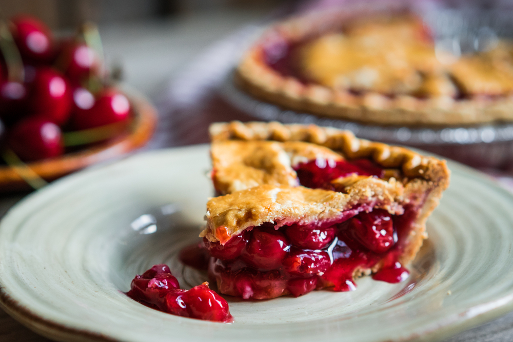 Homemade Cherry Pie On A white plate on a table