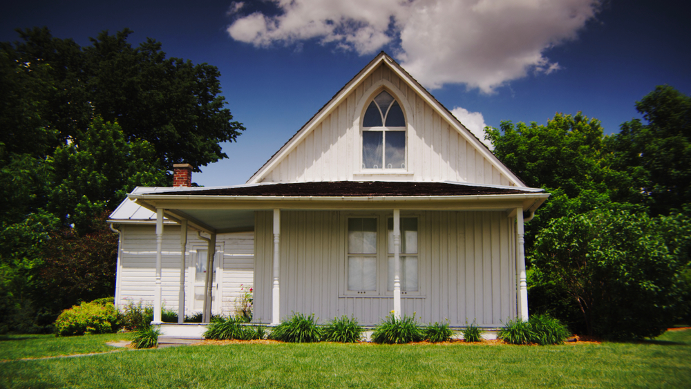 The front of the American Gothic House, a simple, white building and one of the best things to do in Iowa.