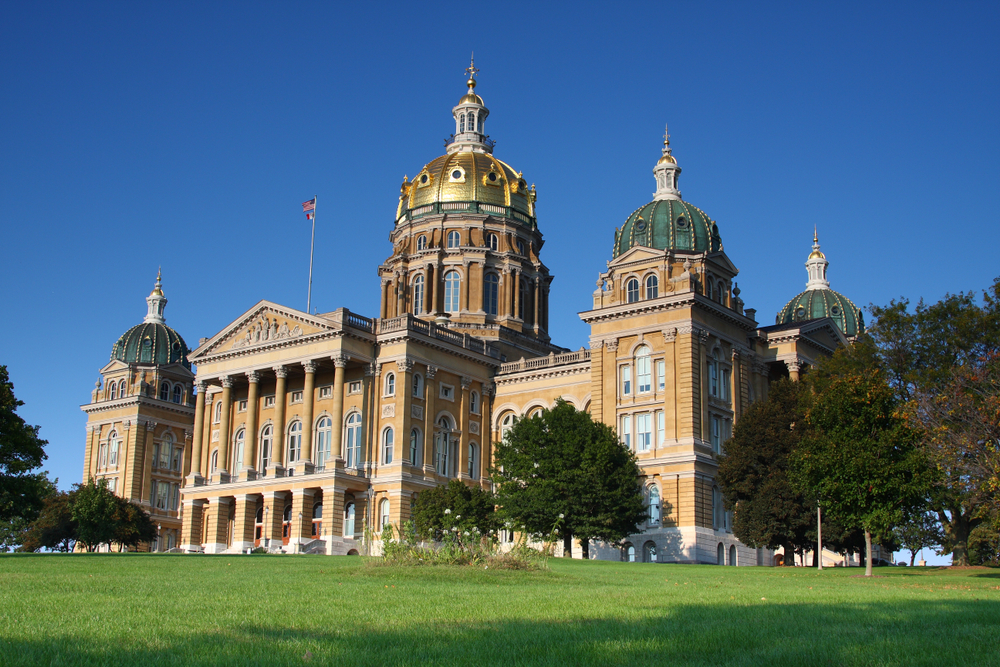 Large ornate capitol building with gold accents and domes. One of the interesting things to do in Iowa