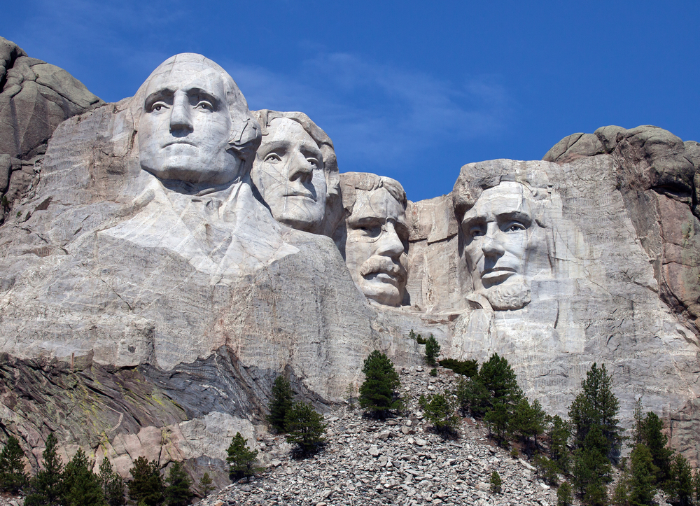 Heads of 4 presidents carved into rock of mountain. Things to do in South Dakota not to miss.