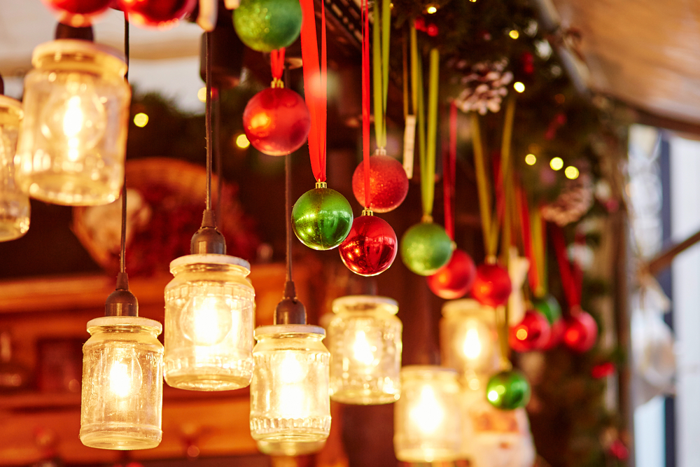 Christmas decorations hanging in a market stall.