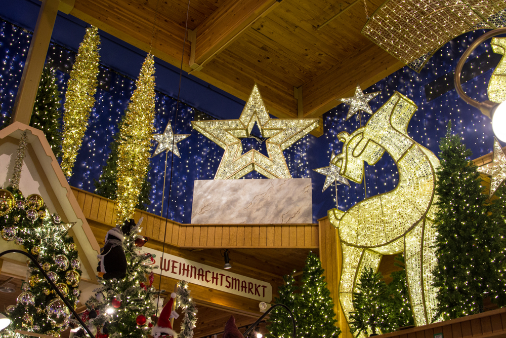 Festive blue and white display featuring large illuminated reindeer