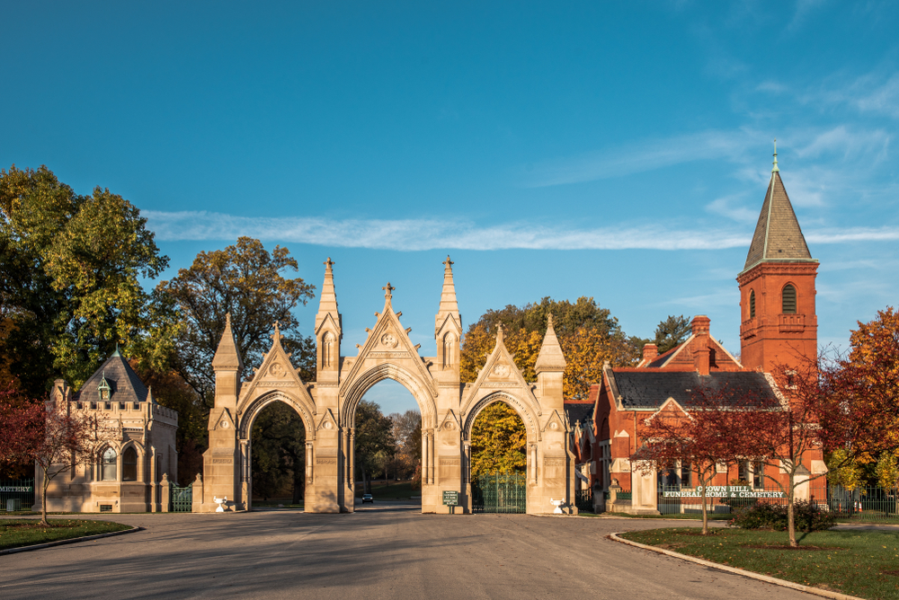 The entrance to the Crown Hill Cemetery bathed in golden light.