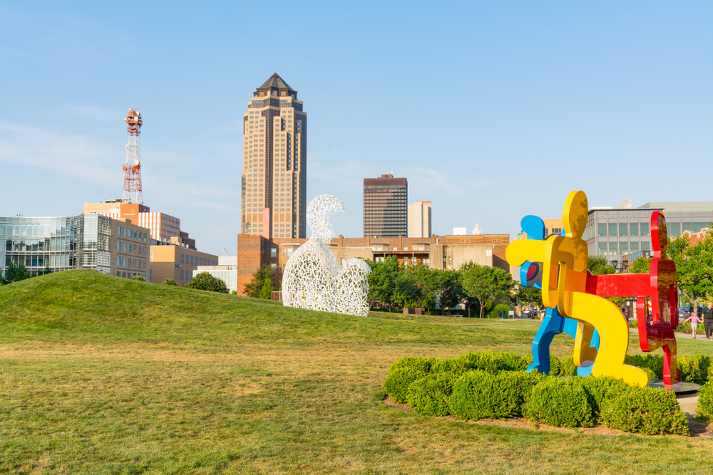 Big sculptures at Pappajohn Sculpture Park with the city in the background.