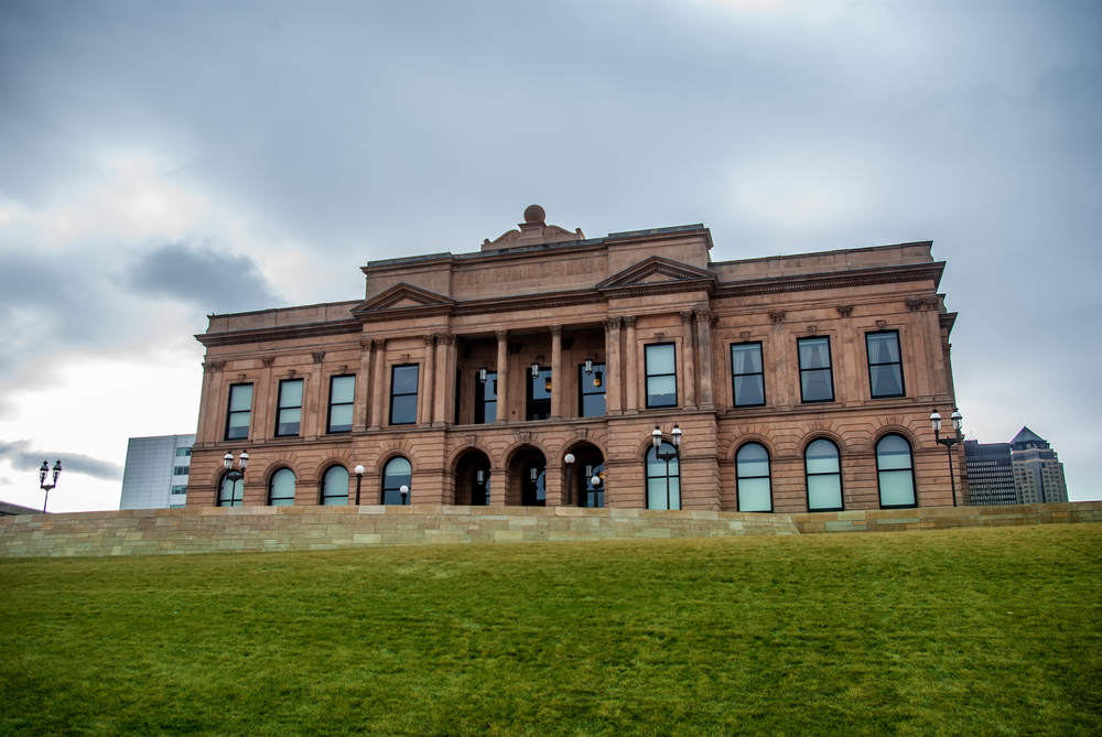 The World Food Prize Hall of Laureates looks imposing on a hill under a dark sky.