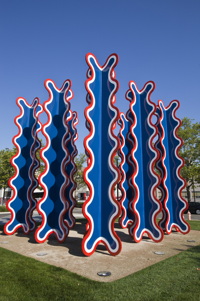 An abstract sculpture is depicted.  Tall wiggle turrets of red, white and blue stand tall in front of the Columbus Museum of Art, one of the most charming things to do in Columbus Ohio