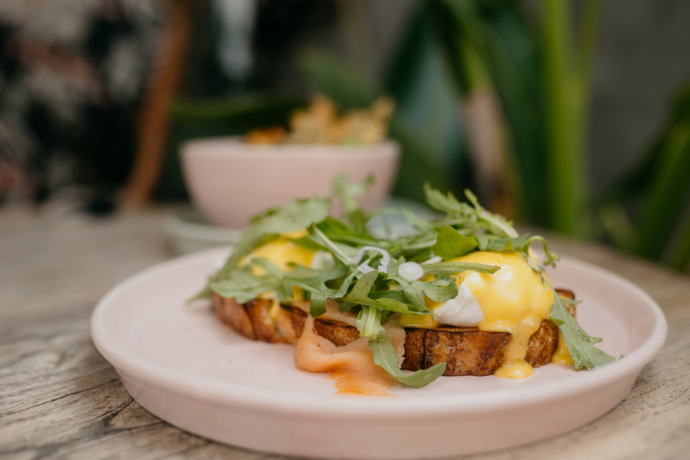 Two eggs on toast with hollandaise sauce over