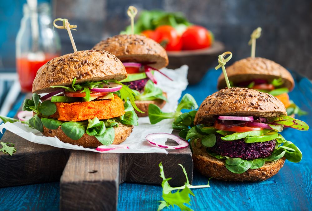 small veggie burgers on a chopping board