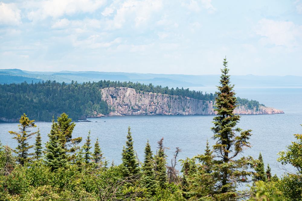 The shoreline of Lake Superior At Grand Marais. Trees in the foreground