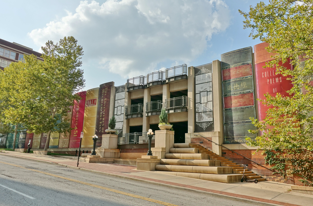 The Community Bookshelf with trees on either side.