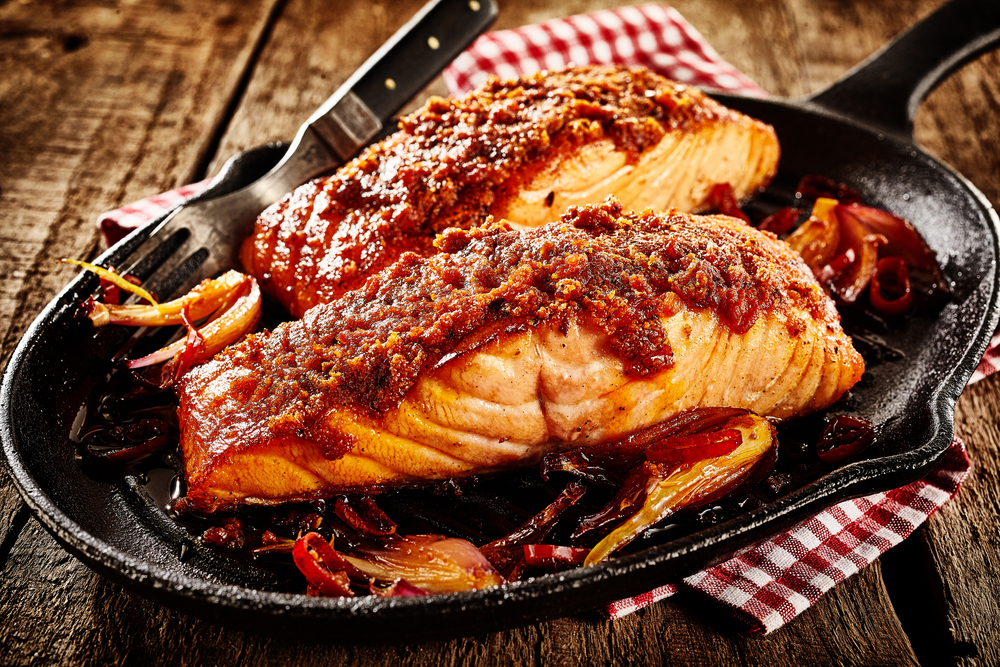 Two pieces if spicy salmon Mexican style in a skillet in an article about restaurants in Branson