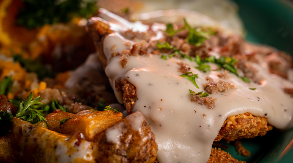 Chicken fried steaks with cheese sauce