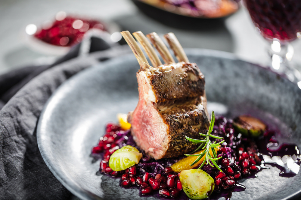 Lamb on a plate surrounded by garnish in an article about restaurants in Branson