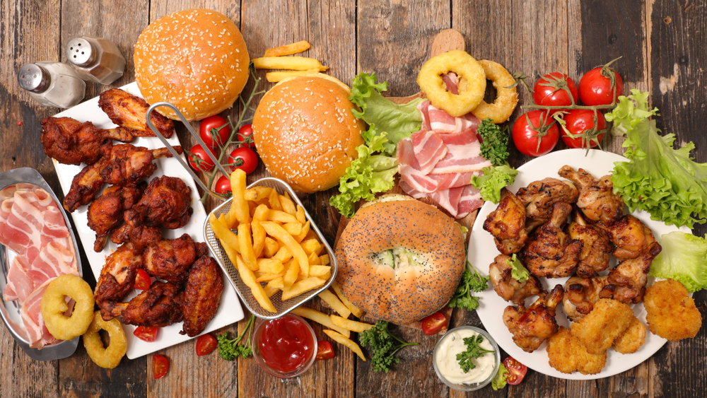 Overhead view of American food including French fries, wings, bagels, onion rings. Restaurants in Lincoln NE.