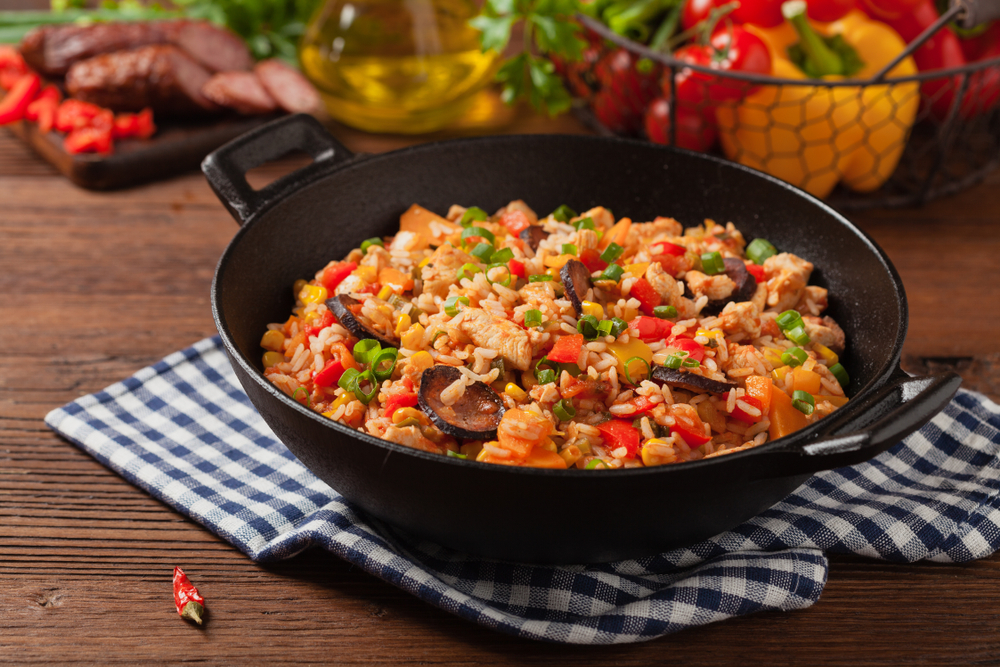 Traditional Bayou Jambalaya om black bowl on blue checked cloth. Lincoln Nebraska restaurant.